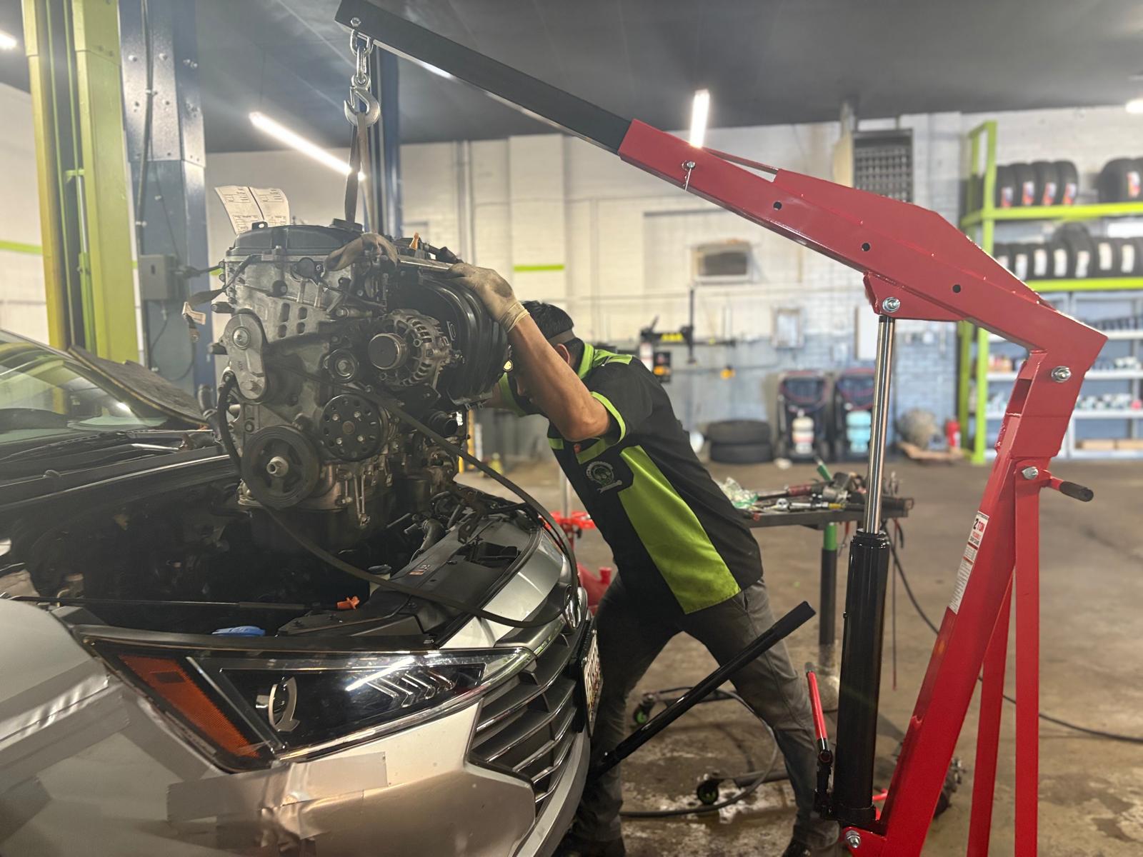 Technician installing new gaskets during an engine repair