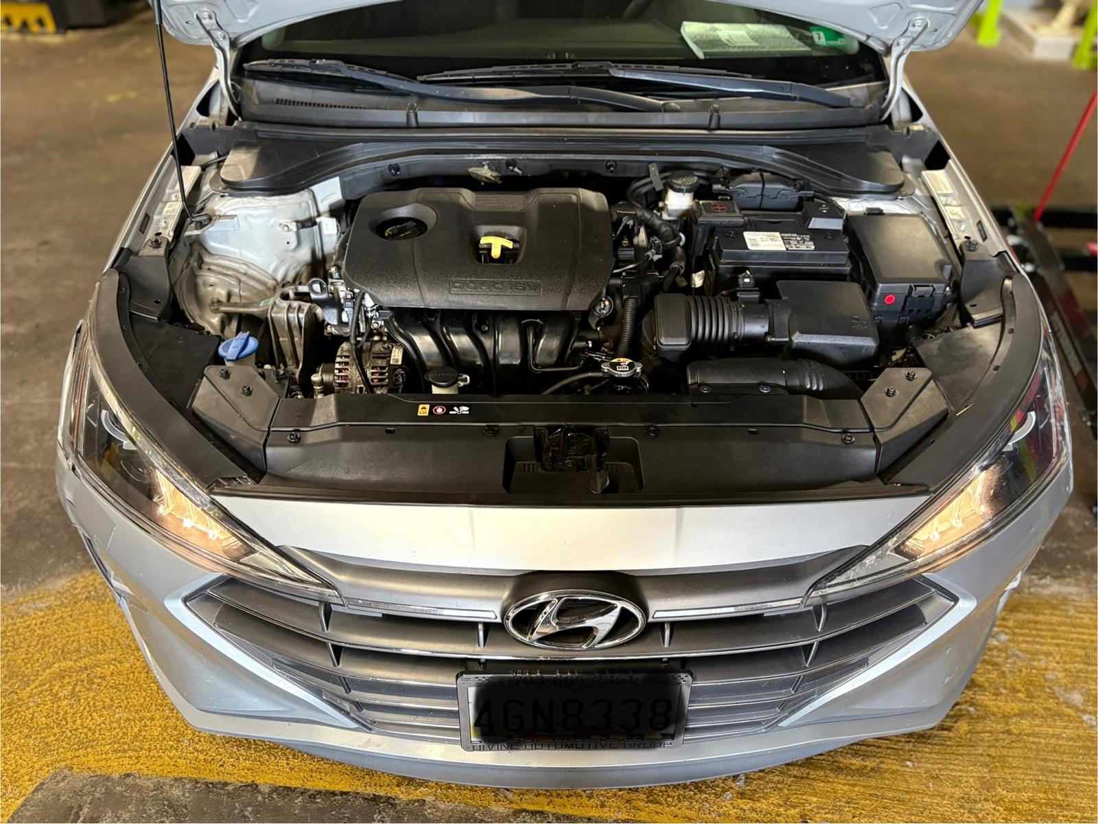 EMA Tire & Auto technician reassembling engine components