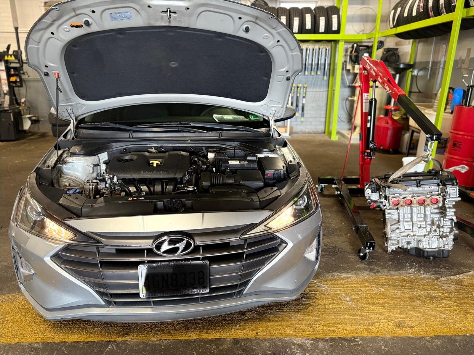 Vehicle lifted for undercar inspection during engine service